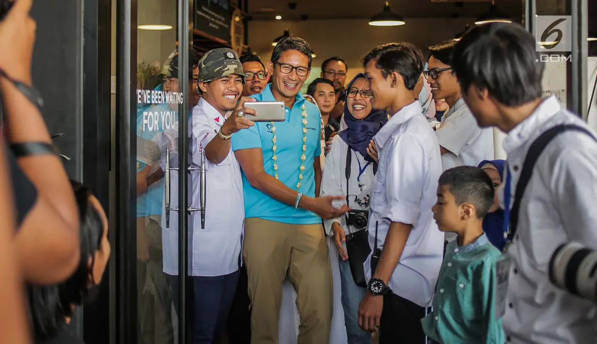 Sandiaga Uno saat menghadiri acara diskusi milenial di kawasan Jakarta, Minggu (14/7/2019). Diskusi bertema ‘Sikap Milenial Pasca Pilpres 2019 & Peran Serta Milenial dalam Menciptakan Lapangan Kerja dan Industri Kreatif’. (Liputan6.com/Faizal Fanani)