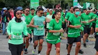 Peserta berlari saat mengikuti lomba lari di kawasan Senayan, Jakarta, Minggu (4/9/2022). Lomba lari Milo ACTIV Indonesia Race (MAIR) 2022 yang terbagi dalam beberapa kategori yaitu 10K, 5K dan family run 2,5K tersebut untuk menyambut hari Olahraga Nasional yang jatuh pada 9 September mendatang. (Liputan6 com/Angga Yuniar)