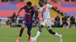 Tiga gol Barca, dua di antaranya dilesakkan Pedri dan satunya dicetak Robert Lewandowski. (MANAURE QUINTERO / AFP)