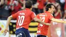 Osasuna's Juanfran (R) celebrates his goal during a Spanish league football match against Real Madrid, on May 31, 2009, at Reyno de Navarra stadium in Pamplona. AFP PHOTO/Rafa Rivas 