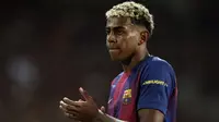 Reaksi penyerang Barcelona Spanyol #10, Lamine Yamal, selama pertandingan phase league match 2 Liga Champions antara FC Barcelona dan Paris Saint-Germain (PSG) di Estadi Olimpic Lluis Companys di Barcelona, ​​pada 1 Oktober 2025. (Josep LAGO/AFP)