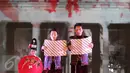 Peraih medali emas Olimpiade 2016, Tontowi Ahmad dan Liliyana Natsir membacakan teks Sumpah Pemuda pada pagelaran "Nusantara Berdendang", Jakarta, Jumat (28/10). Acara ini menampilkan seni dan budaya nusantara. (Liputan6.com/Faizal Fanani)