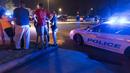 Sejumlah warga menunggu kabar di luar gedung bioskop Lafayette, Louisiana, AS, Kamis (23/7/ 2015). Pria bersenjata  melepaskan tembakan pada Kamis malam  yang  menewaskan dua orang dan melukai tujuh orang lainnya.(REUTERS/Lee Celano)