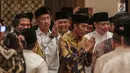 Presiden Joko Widodo (Jokowi) tiba untuk menghadiri acara Buka Puasa Bersama Partai Golkar, di Jakarta, Minggu (19/5/2019). Kegiatan tersebut mengangkat tema Menjemput Kemenangan Ramadan. (Liputan6.com/Faizal Fanani)