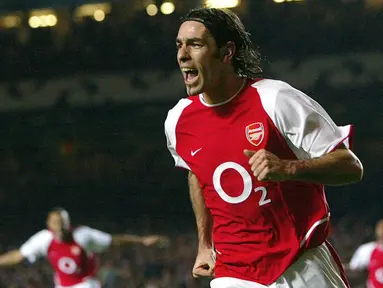 Robert Pires menjadi bagian penting Arsenal dan sangat dicintai fans Arsenal. Pires membawa Arsenal meraih 2 gelar Liga Premier Inggris dan 3 gelar Piala FA. (AFP/Odd Andersen)