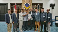 Partai NasDem memberikan surat rekomendasi kepada Ahmad Riza Patria dan Marshel Widianto untuk Pemilihan Wali Kota Tangerang Selatan atau Pilwakot Tangsel. (Merdeka).