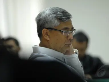Mantan Ketua MK Akil Mochtar menghadapi sidang pembacaan putusan di Pengadilan Tipikor, Senin (30/6/14). (Liputan6.com/Miftahul Hayat)