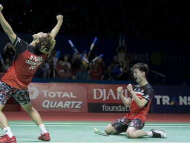 Kevin Sanjaya / Marcus Fernaldi Gideon melawan Hendra Setiawan / Mohammad Ahsan pada final ganda putera Indonesia Open 2019. The Minions menang mudah 2 gim dengan skor 21-19 21-16 di Istora Senayan, Jakarta, Minggu (21/7/2019). (Bola.com/Peksi Cahyo)