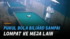 Usai dipukul, bola putih justru melompat ke meja lain hingga kemudian memecah susunan bola di meja ke-3.