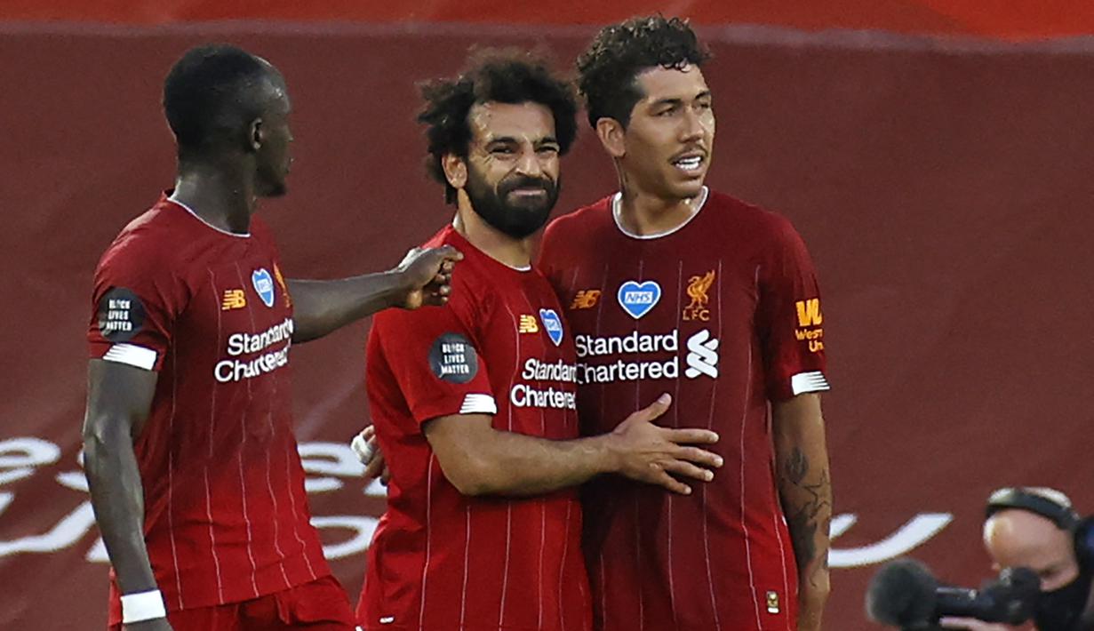 Kolaborasi keduanya plus Roberto Firmino di lini depan Liverpool membuat The Reds meraih kejayaannya baik di level domestik maupun di pentas Eropa. (AFP/Pool/Phil Noble)