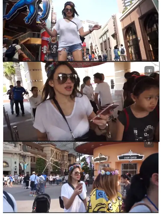 Berhenti sebentar, lantas meneruskan jalannya, janda dua anak itu cuek saat mengenakan dan melepas kaos yang di kenakan sembari jalan. (dok. vidio.com)