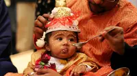 Tiap negara mempunyai tradisi unik memeringati kelahiran seorang anak. Apa saja?