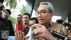 Sekjen Kementerian Pekerjaan Umum dan Perumahan Rakyat (PUPR) Taufik Widjoyono keluar dari Gedung KPK, Jakarta, Jumat, (9/12). Taufik diperiksa dalam kasus dugaan suap proyek di Kementerian PUPR tahun anggaran 2015-2016. (Liputan6.com/Helmi Afandi)