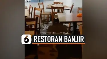 Sebuah restoran di Cyprus terendam banjir usai dilanda hujan deras.  Air menggenang dengan ketinggian mencapai 30 cm.