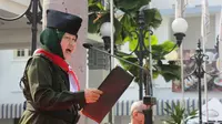 Walikota Surabaya Tri Rismaharini atau Risma saat membacakan pidato kebangsaan dalam peringatan perobekan bendera Belanda di Hotel Yamato, Jalan Tunjungan Surabaya, Sabtu (19/9/2015). (Liputan6.com/Dian Kurniawan)