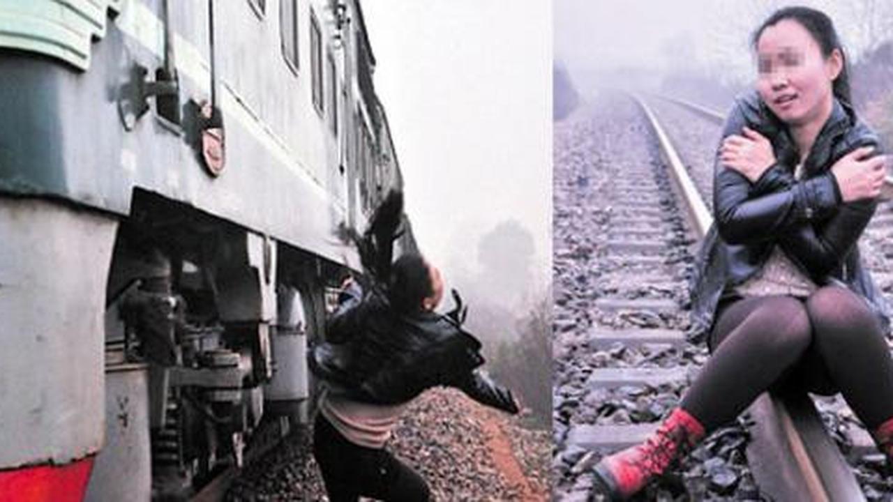 Perempuan China hampir tersambar kereta saat berfoto di atas rel