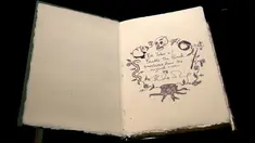 Salah satu dari tujuh eksemplar buku tulisan tangan dan digambar oleh J.K. Rowling di rumah lelang Sotheby, London, 9 Desember 2016. Buku berjudul The Tales of Beedle the Bard itu terjual 467 ribu dolar AS atau sekitar Rp6,2 miliar. (Justin TALLIS/AFP)