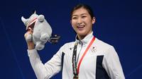Perenang Jepang, Rikako Ikee, berjanji akan kembali lagi mengunjungi Indonesia yang dianggapnya sebagai negara pemilik kesan mendalam dalam hidupnya. (AFP/Jewel Samad)