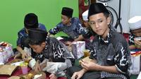 Clairmont dengan mengadakan buka puasa bersama anak yatim