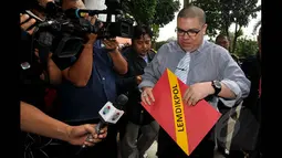 Budi Gunawan melalui kuasa hukumnya melaporkan KPK terkait penetapan status tersangka terhadap dirinya yang dianggap menyalahgunakan wewenang karena tidak sesuai prosedur, Jakarta, Rabu (21/1/2015). (Liputan6.com/Miftahul Hayat)
