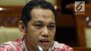 Capim KPK Nurul Ghufron menyampaikan pendapatnya saat mengikuti uji kelayakan dan kepatutan (fit and proper test) dengan Komisi III DPR di Kompleks Parlemen, Jakarta, Rabu (11/9/2019). Ghufron menambahkan, kewenangan SP3 bagi KPK tetap harus dengan syarat-syarat tertentu. (Liputan6.com/JohanTallo)