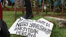 Mahasiswa dari berbagai universitas melakukan aksi unjuk rasa di kawasan Patung Kuda, Jakarta Pusat, Senin (4/11/2022). Sejumlah mahasiswa meramaikan kawasan Patung Kuda dalam aksi demo 11 April ini. (Liputan6.com/Helmi Fithriansyah)