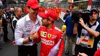 Toto Wolff bersama Sebastian Vettel. (AFP/Andrej Isakovic)