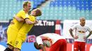 Pemain Borussia Dortmund, Erling Braut Haaland melakukan selebrasi bersama Julian Brandt usai mencetak gol ke gawang RB Leipzig pada laga  Bundesliga di Red Bull Arena Sabtu (20/6/2020). RB Leipzig takluk 0-2 dari Borussia Dortmund. (AP/Jens Meyer)