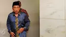 Mantan Bupati Bangkalan, Jawa Timur, Fuad Amin saat akan mengikuti sidang lanjutan di Pengadilan Tipikor, Jakarta, Senin (1/6/2015). (Liputan6.com/Yoppy Renato) 
