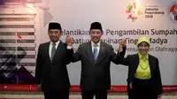 Menpora Imam Nahrawi (tengah) resmi melantik Gatot S. Dewa Broto (kiri) sebagai Sesmenpora baru di Jakarta, Jumat (24/2/2017). (Kemenpora/Bagus)