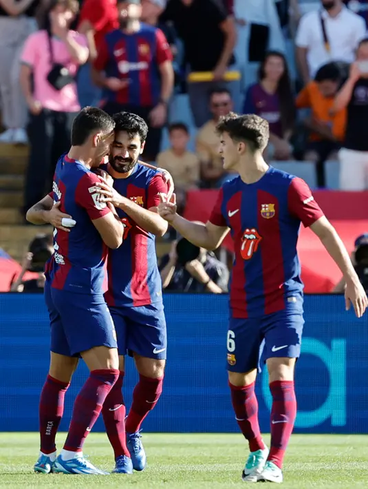 <p>Tuan rumah memimpin berkat gol cepat Ilkay Gundogan pada menit ke-6. Namun, Jude Bellingham terus berkontribusi pada awal kariernya bersama tim tamu. (AP Photo/Joan Monfort)</p>