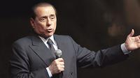 Italian Prime Minister Silvio Berlusconi delivers a speech during the &quot;Festa della Liberta&quot; (The freedom festival) organised by his party &quot;Il popolo della Liberta&quot; (the people of freedom) on October 5, 2008, in Milan. AFP PHOTO/Emilio 