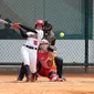 Atlet softball Indonesia, Putri Vinny Anugerah Dewi memukul bola pada pertandingan Grup A softball Asian Games 2018 melawan China di Lapangan Softball GBK, Senayan, Jakarta, Minggu (19/8). Indonesia kalah telak atas China 0-14. (Liputan6.com/Fery Pradolo)