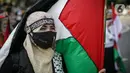 Massa Gerakan Pekerja Muslim Indonesia (GPMI) melakukan aksi solidaritas untuk Palestina di kawasan Thamrin Jakarta, Jumat (28/5/2021). Mereka menyuarakan keprihatinan atas tragedi kemanusiaan di Palestina, serta mewujudkan perdamaian dunia dan kemerdekaan atas Palestina (Liputan6.com/Faizal Fanani)