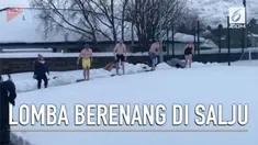 Perlombaan renang ekstrem, yakni berenang di antara tumpukan salju digelar di Skotlandia.