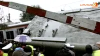 `Pak Ogah` di Perlintasan Kereta, Membantu atau Mengganggu?