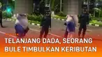 Aksi seorang bule telanjang dada di tengah jalan mengundang perhatian
