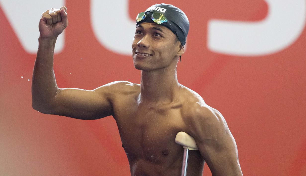 Jendi Panggabean perenang Indonesia saat beraksi pada kualifikasi cabang renang nomor 100 meter gaya bebas putra klasifikasi S9 Asian Para Games 2018 di Stadion Akuatik, Gelora Bung Karno Jakarta, Senin (8/10/2018). (Bola.com/Peksi Cahyo)
