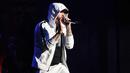 Rapper asal AS, Eminem saat tampil di atas panggung selama Coachella Valley Music and Arts Festival 2018 di Empire Polo Field di Indio, California (15/4). Festival Coachella ini sudah ada sejak 1999. (AFP Photo/Kevin Winter)