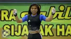 Lifter Jabar, Sri Wahyuni Agustiani bersorak usai mengangkat beban di kelas 48 kg PON XIX Jabar di Gelora Sabilulungan, Kab Bandung, Selasa (20/9). Total angkatan Sri Wahyuni 182 Kg sekaligus memecahkan rekor nasional. (Liputan6.com/Helmi Fithriansyah)