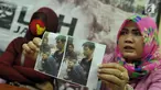 Lembaga Bantuan Hukum Jakarta menunjukkan foto korban yang diduga mendapat penyiksaan dari polisi, Jakarta, Minggu (28/5). Keluarga korban meminta LBH untuk mendapat pendampingan hukum. (Liputan6.com/Helmi Afandi)