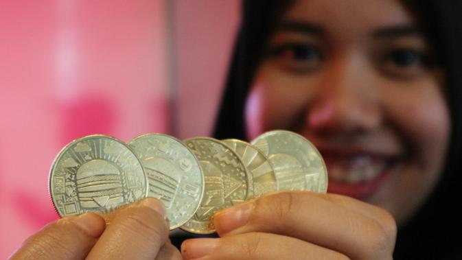 Merayakan ulang tahun Big Mac ke-50, McDonald’s meluncurkan mata uang global pertama di restoran cepat saji yaitu MacCoin