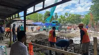 Proyek pembangunan Gedung Layanan Dinas Perpustakaan Makassar (Liputan6.com/Eka Hakim)
