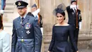 Duchess of Sussex, Meghan Markle bersama suaminya Pangeran Harry  tiba menghadiri kebaktian di Westminster Abbey, London, (10/7). Meghan Markle tampil cantik dengan mengenakan gaun klasik Dior berwarna biru. (AFP Photo/Chris J Ratcliffe)