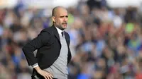 Raut wajah kekhawatiran pelatih Manchester City Pep Guardiola saat melawan Huddersfield Town. (Mike Egerton/PA via AP)