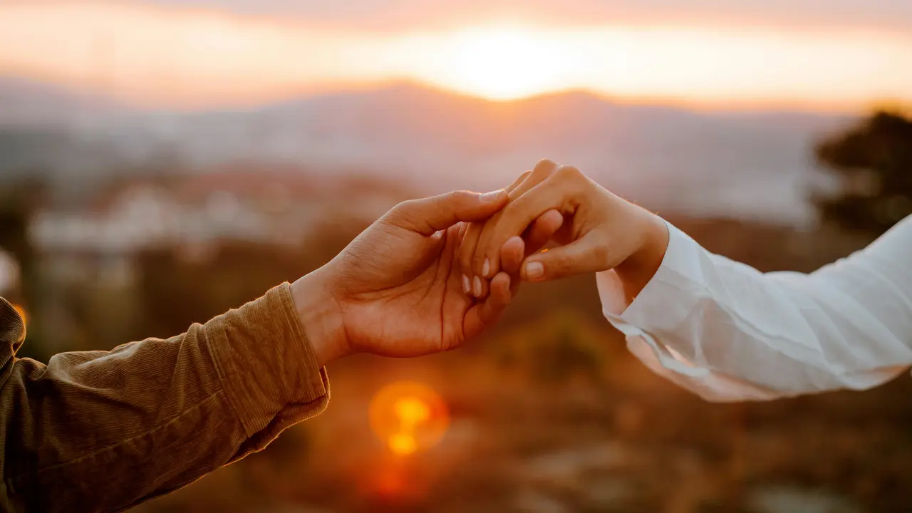 couple september holding hands