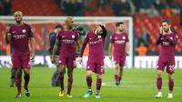 Pemain Manchester City merayakan kemenangannya usai melawan Tottenham Hotspur pada pertandingan Liga Inggris di Wembley Stadium di London (14/4). Kemenangan ini mendekatkan Manchester City sebagai juara Liga Inggris. (AP Photo / Tim Ireland)