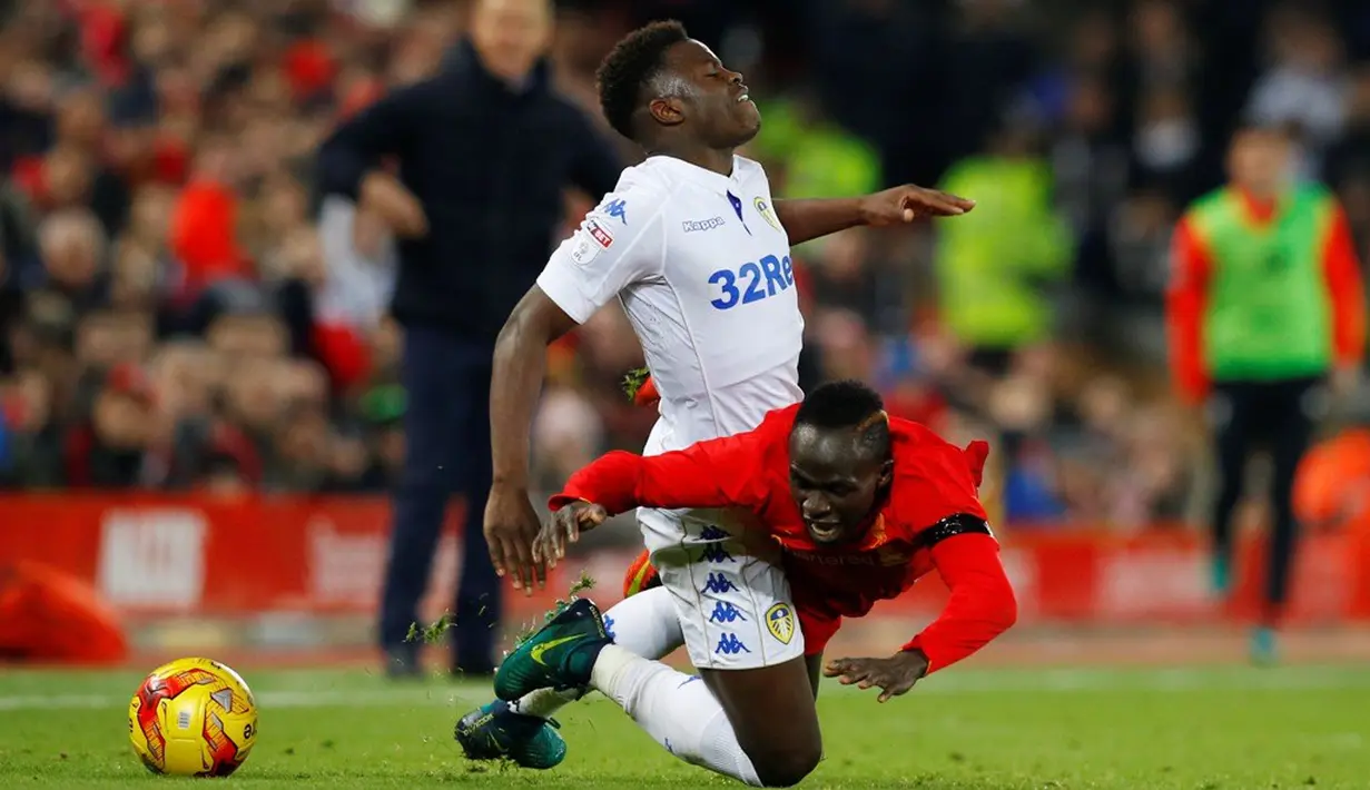 Ekspresi pemain Liverpool, Divock Origi, setelah mencetak gol pertama ke gawang Leeds United pada laga perempat final Piala Liga Inggris di Stadion Anfield, Selasa (29/11/2016). (Reuters/Phil Noble)
