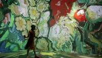 Seorang penari menari dalam pameran multimedia Van Gogh Live 8K yang menampilkan proyeksi lukisan seniman Belanda Vincent Willem van Gogh, pada pembukaan pameran untuk media dan tamu, di Rio de Janeiro, Brasil, Rabu (27/7/2022). (AP Photo / Bruna Prado)
