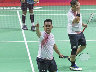 Ekspresi Hafizh Briliansyah Prawiranegara atlet bulutangkis Indonesia usai lolos ke babak final di Asian Paragames 2018  di Istora Senayan, Minggu (7/10/2018).  (Bola.com/Peksi Cahyo)